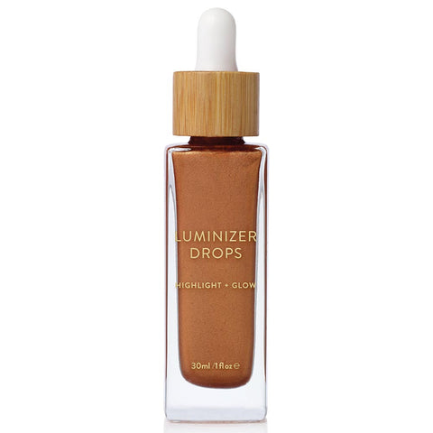 A radiant, metallic bronze liquid highlighter packaged in its glass dropper bottle.