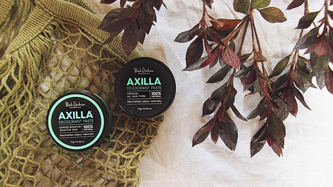 2 Black Chicken Axilla Deodorants on an olive-coloured mesh bag with leaves in the background.