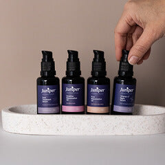 Juniper Skincare products lined up on a ceramic dish. 