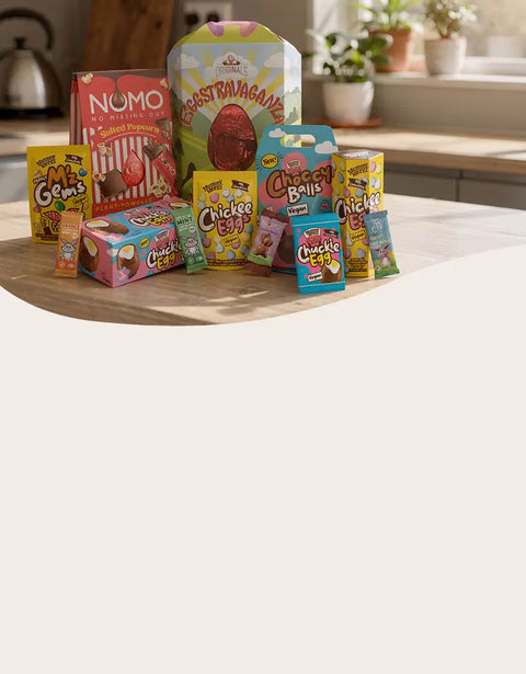 Assorted snack packages on a kitchen counter with a neutral background