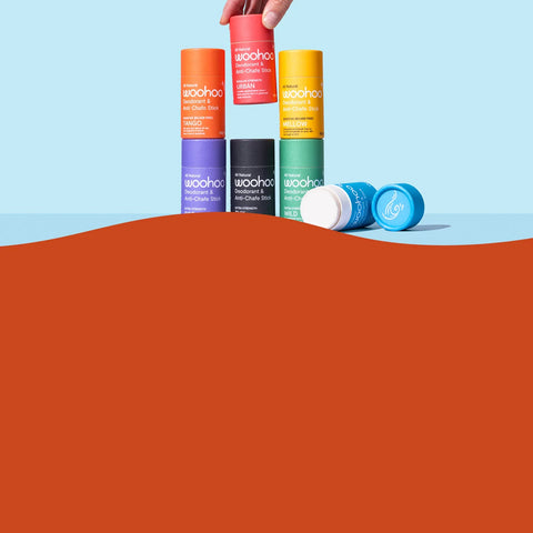 Colorful 'woohoo!' anti-chafe stick packaging on a gradient background