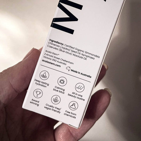 Close up of a hand holding the box packaging with ingredients shown. Made in Australia. 