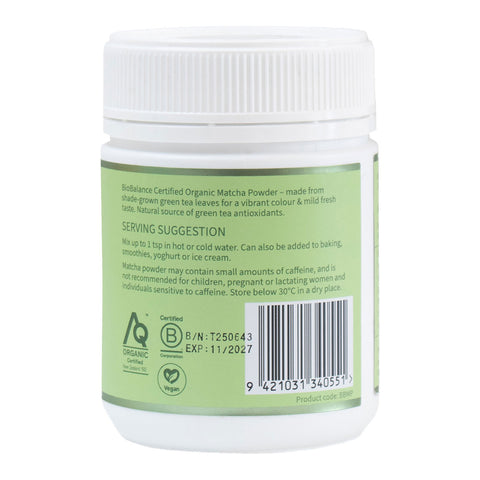Container of organic matcha powder with label on a white background
