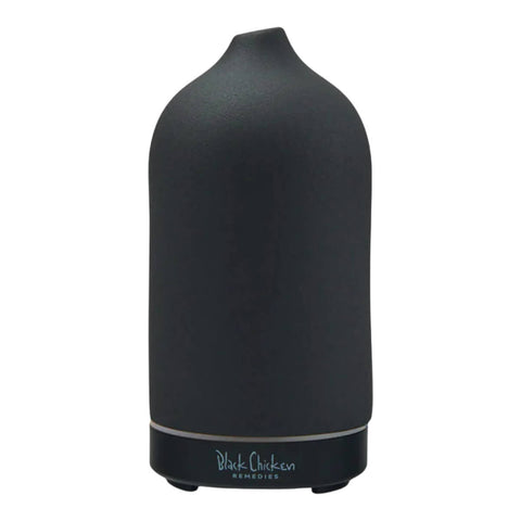 A black, ceramic ultrasonic essential oil diffuser that can quickly and safely charge the air around the room in a cool mist.