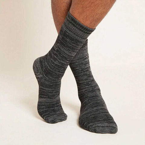 Crew Boot grey marl socks worn by a man on a light beige background