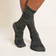 Crew Boot grey marl socks worn by a man on a light beige background