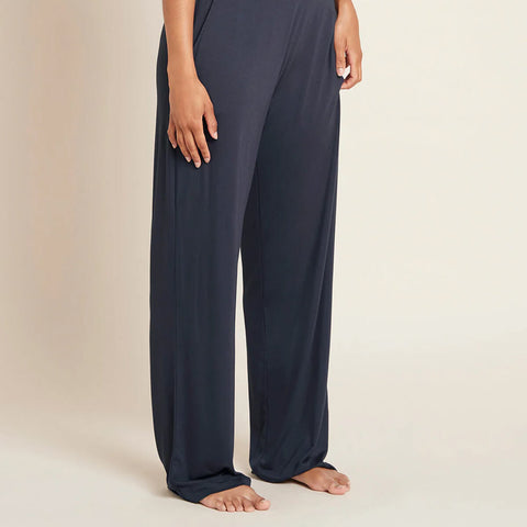 Side of navy blue coloured wide leg pants made of organic bamboo.