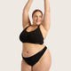Model wearing Black Boody G-String and crop bra.