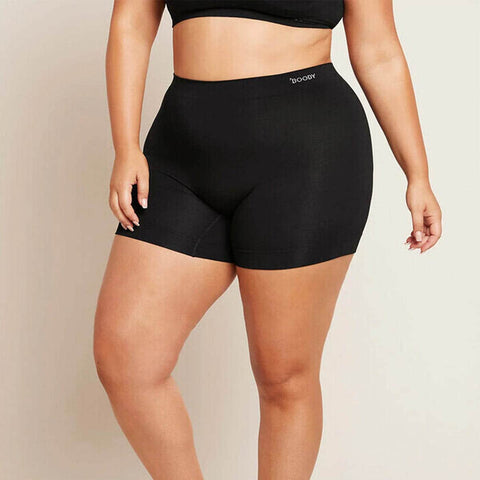 Person wearing black Boody Smoothing Short with matching crop bra.