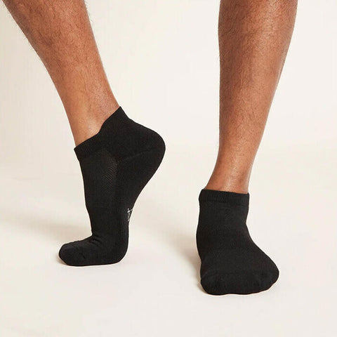 Black sport ankle socks worn by a man.