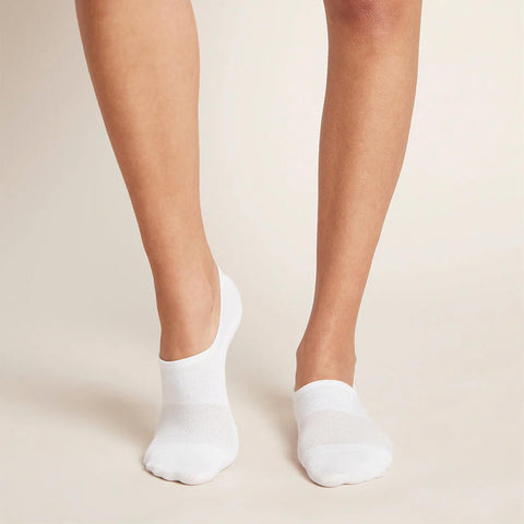 A pair of white low-cut socks modelled on feet.