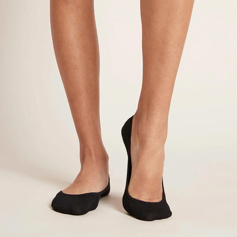 A pair of black, women's everyday liner socks modelled on feet.