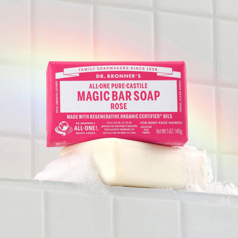 Dr. Bronner's Pure-Castile Magic Soap Bar - Rose 140g on a white surface with a blurred background.
