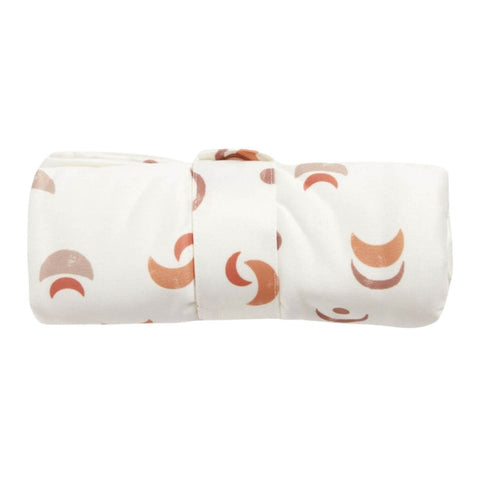 Rolled up EcoNaps Changing Mat with snap loop closure. Desert moon pattern.