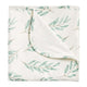 Folded change mat with olive leaf pattern.