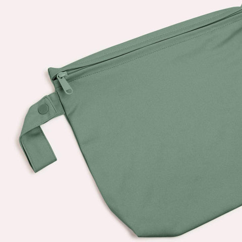 Close up of snap loop handle and zip closure of EcoNaps mid wet bag.