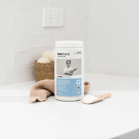 ecostore product on a bathroom counter with a white tiled wall background.