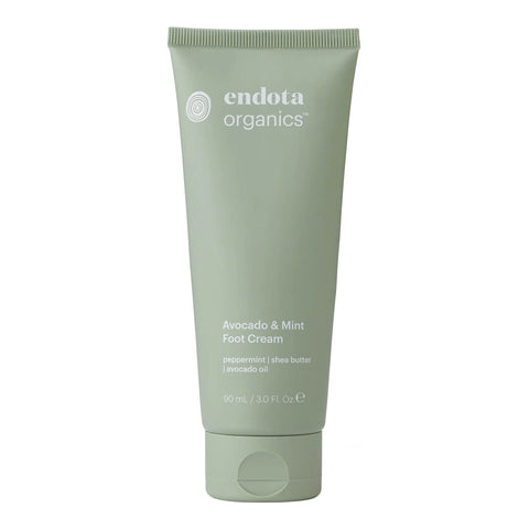 Green tube of endota organics Avocado & Mint Foot Cream 90ml on a white background