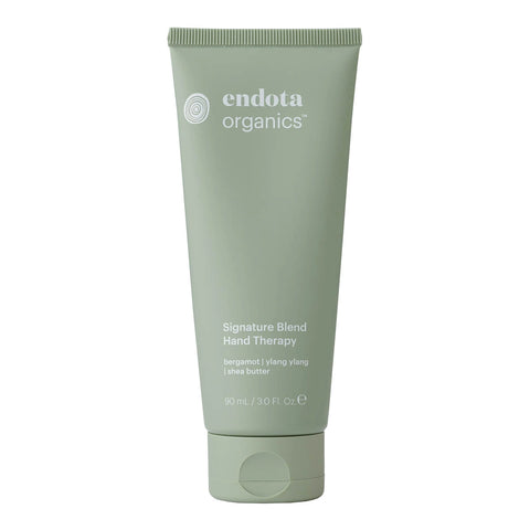 Green tube of endota organics hand therapy 90ml on a white background