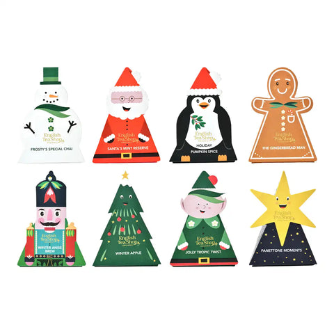 Eight Christmas-themed paper candy boxes arranged in a 2x4 grid on a plain white background.