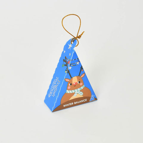 Winter balance tea packaged in a reindeer decoration.