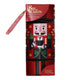 A boxed tea product on a plain white background. The package is predominantly red with a large nutcracker illustration in the center.