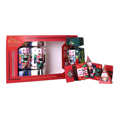 A Christmas nutcracker gift set displayed in a red box with several decorated nutcrackers.