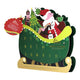 A Christmas advent calendar shaped like a green sleigh with gold wheels and base.