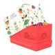 Advent tea box, featuring a bright red outer box with delicate line-art illustrations, a white inner box decorated with colorful festive illustrations.