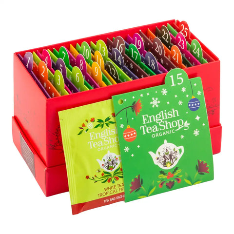 An English Tea Shop tea advent box containing individually wrapped tea bags in colorful pouches.