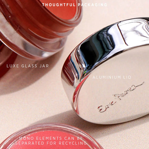 Carrot colour pot close up showing packaging components. Aluminium lid, luxe glass jar on a beige background, highlighting eco-friendly packaging.
