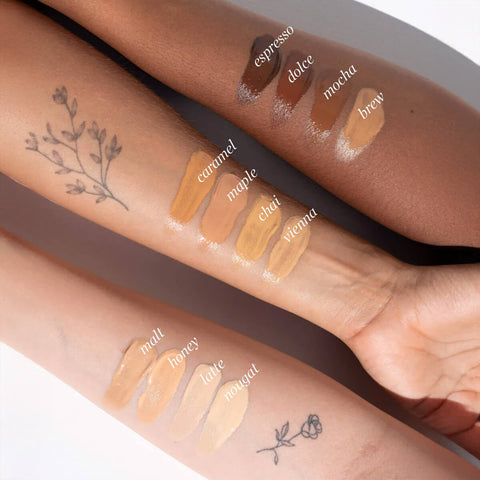 Oat Milk Foundation swatches on arms with different skin tones.