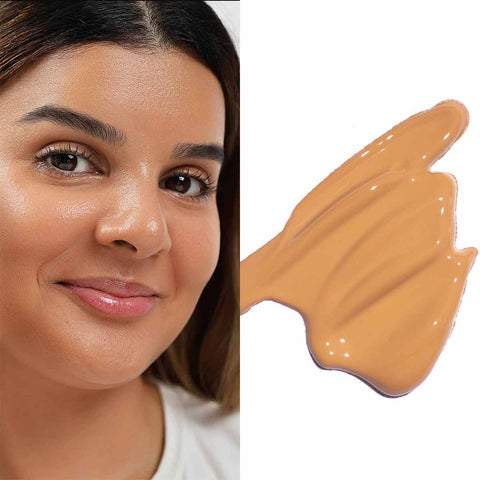 Close-up of a woman's face with a swatch of foundation color next to it.