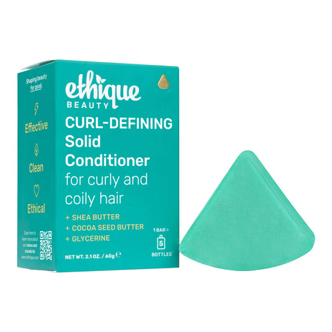 Ethique Curl-Defining Solid Conditioner for Curly and Coily Hair 110g box next to blue bar.