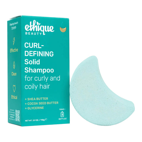 Ethique Curl-Defining Solid Shampoo for Curly and Coily Hair 110g box next to blue bar.