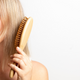 Ever Eco hair brush being used on fine blonde hair.