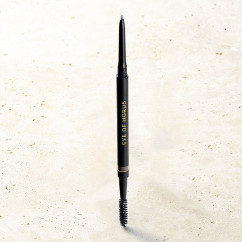 Eyebrow pencil with 'Eye of Horus' branding on a light beige background