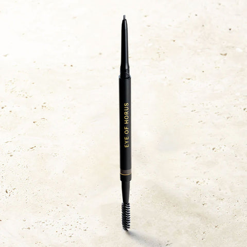 Black eyebrow pencil with 'Eve of Horus' branding on a light beige background