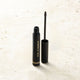 Eye of Horus Brow Fibre Extend Dynasty on a stone surface.