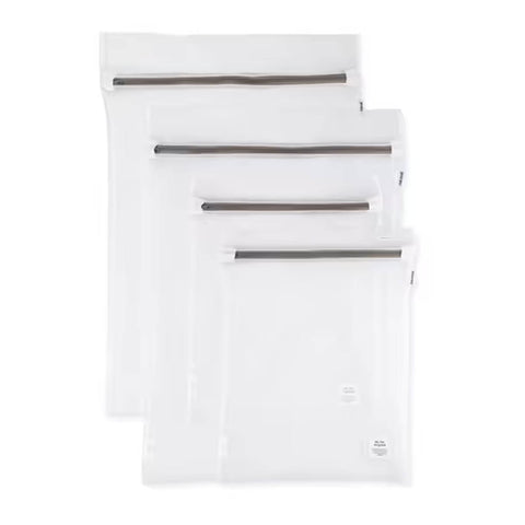 Set of white mesh bags with zippers on a white background