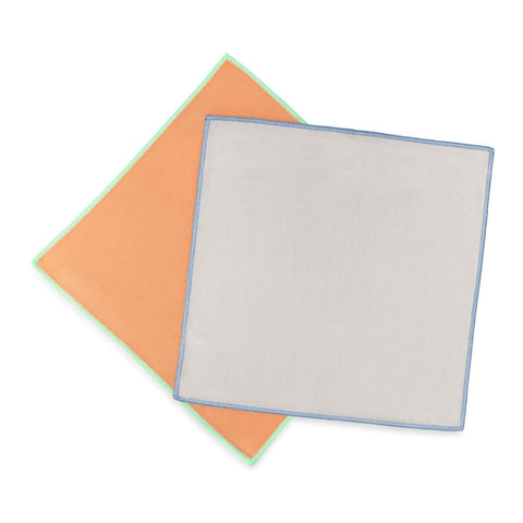 Two cloths, one orange and one grey with a blue border, on a white background.