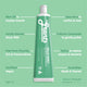 Green tube of Grants toothpaste with text on a green background.