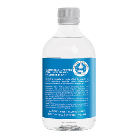 The left side of a clear bottle of mint flavoured, natural mouthwash with xylitol showing its ingredients.