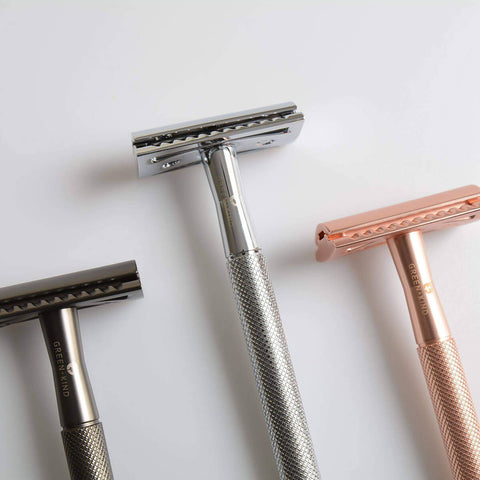 Three razors on a light grey background.