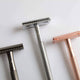 Three razors on a light grey background.