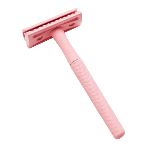 Stainless steel safety razor with a pastel pink finish.