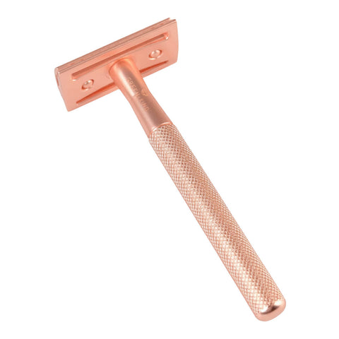 Stainless steel safety razor with a rose gold finish.