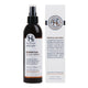 A bottle of Essential Scalp Spray by Holistic Hair packaging box, displaying the product and brand name, description, and award-winning information.