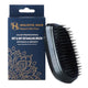 Salon professional wet & dry detangling brush by Holistic Hair. Brush pictured next to packaging on a white background.