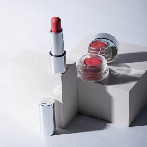 Flushed shade of cheek & lip cream available in a pot and stick. Displayed on a block against a white background.